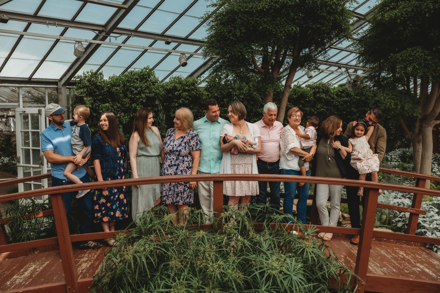 extended family photo, green house