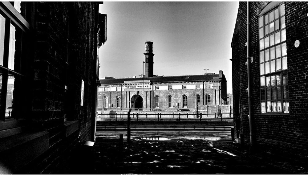paul heaney photography view from an old foundry yard of heritage industrial buildings of tower works in holbeck leeds