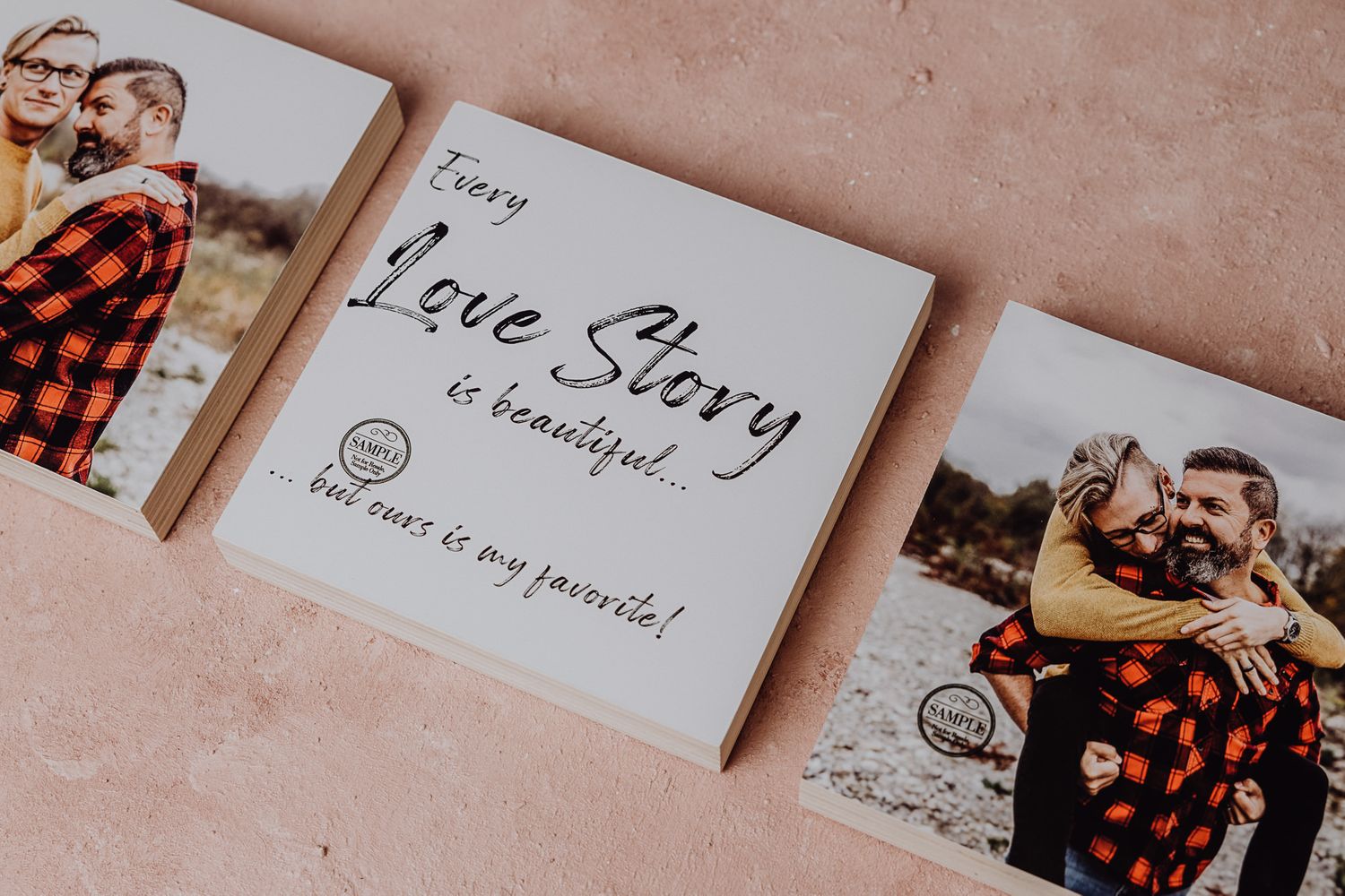 Handwritten love story note between printed photographs on pink surface.