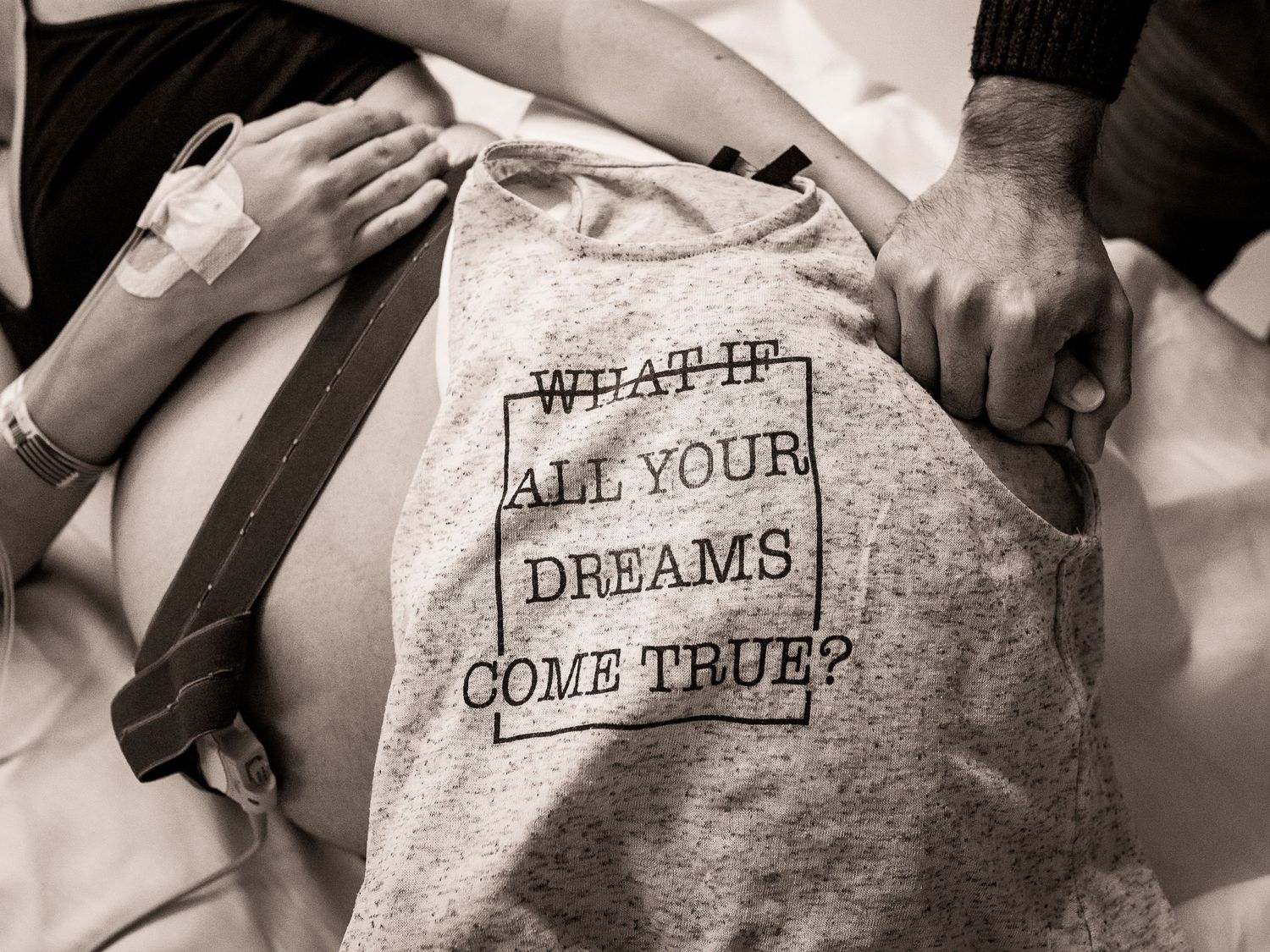 A black and white photo shows a t-shirt with text reading 'What if all your dreams come true?'.