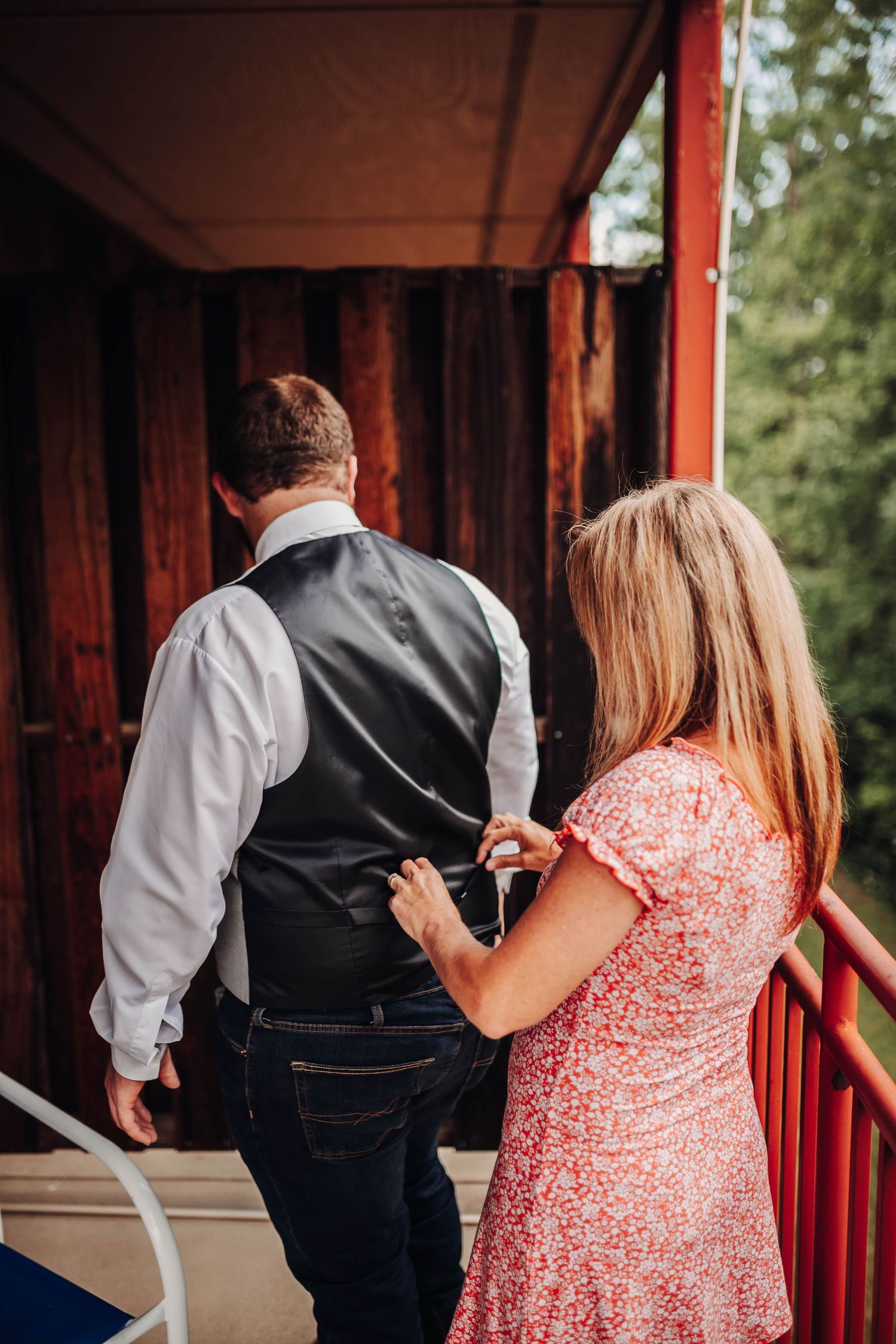 Mom helping son with his tux