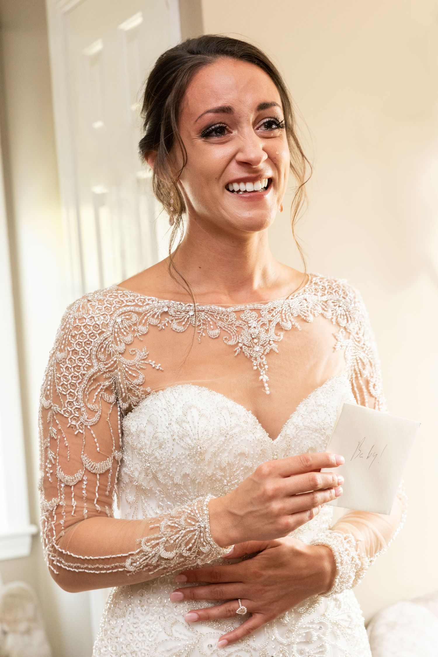 Bride cries reading a note from her husband on their wedding day Leah Ramuglia Photography