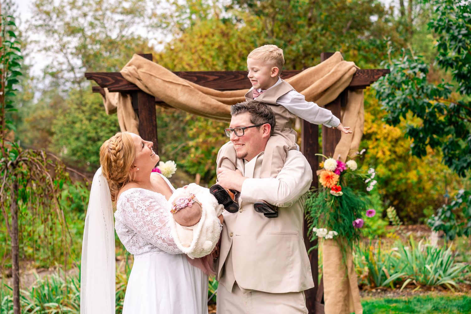 bride and groom with their two kids