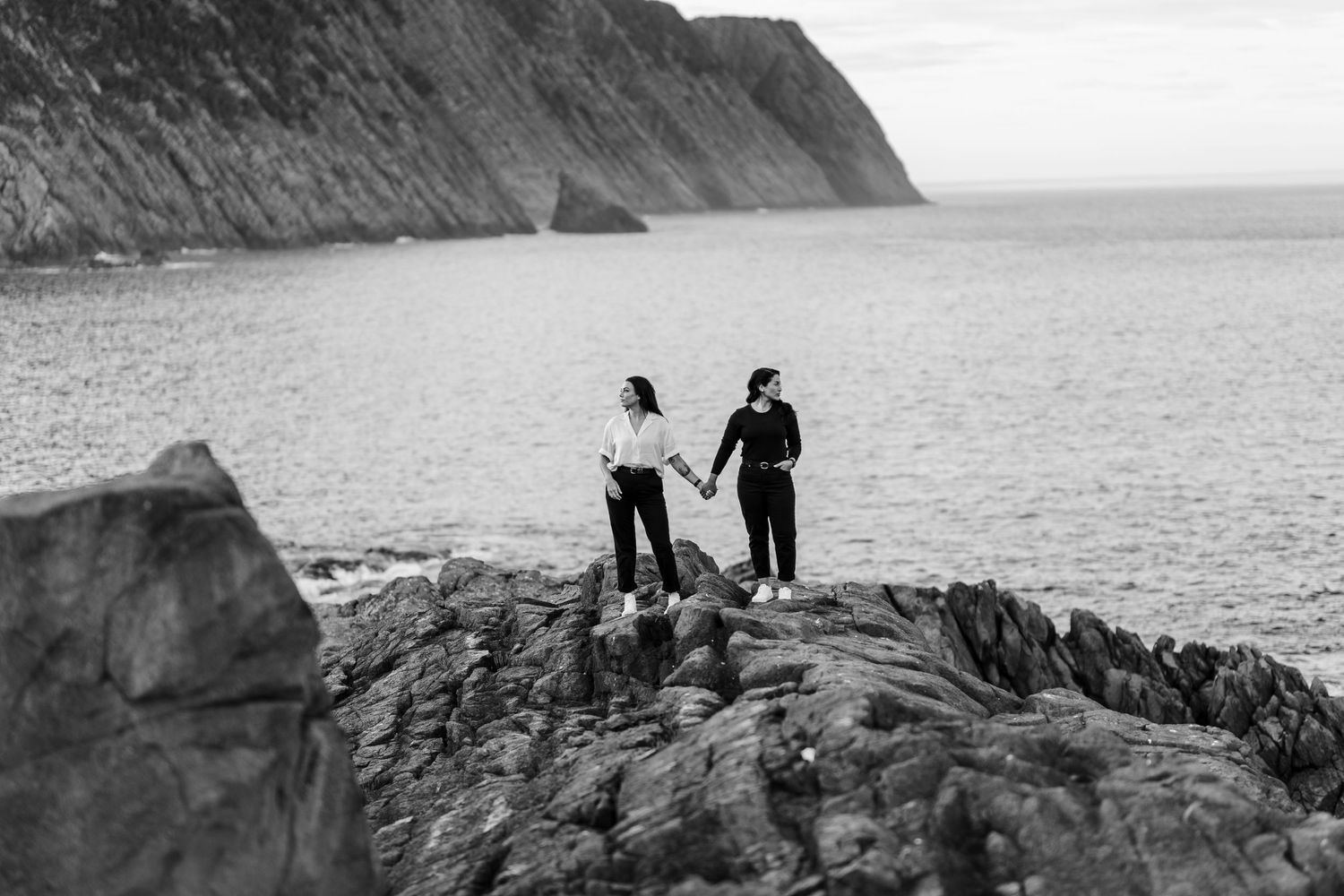 Scenic coastal cliffs overlooking the ocean with dramatic rock formations.