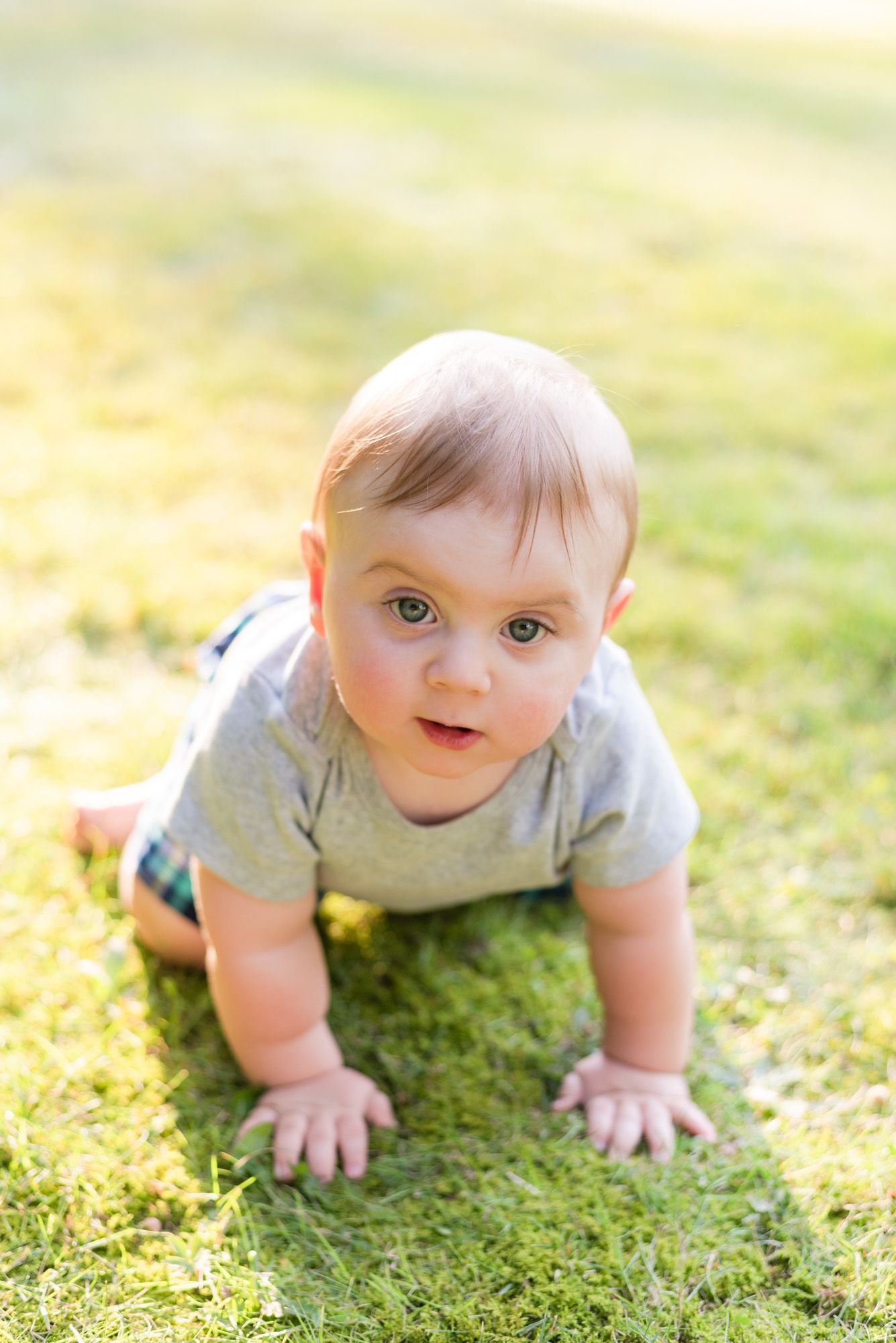 Baby crawling in grass in Mars, Pennsylvania