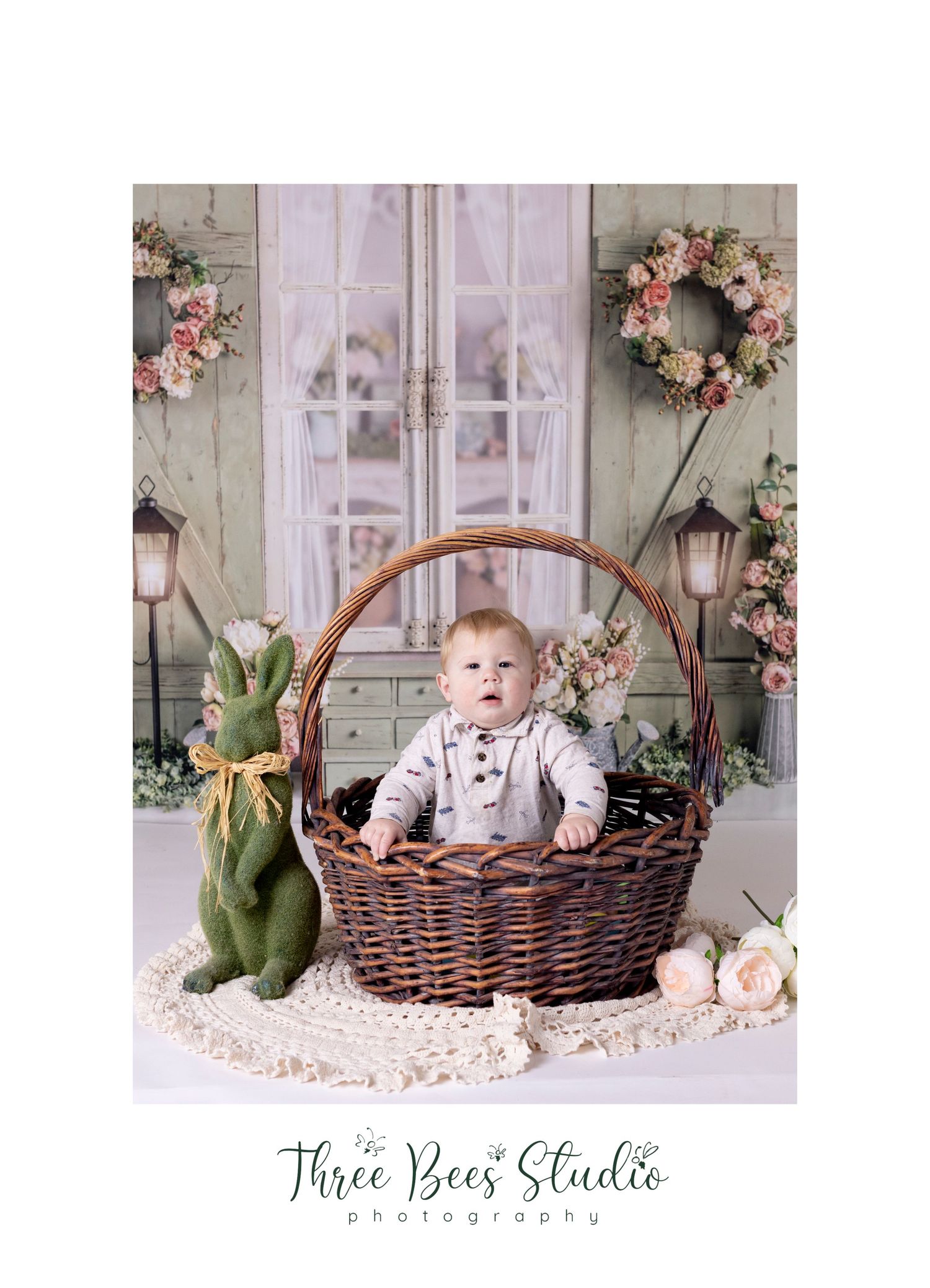 Rustic spring scene with wicker basket, green bunny, and floral wreath decor.