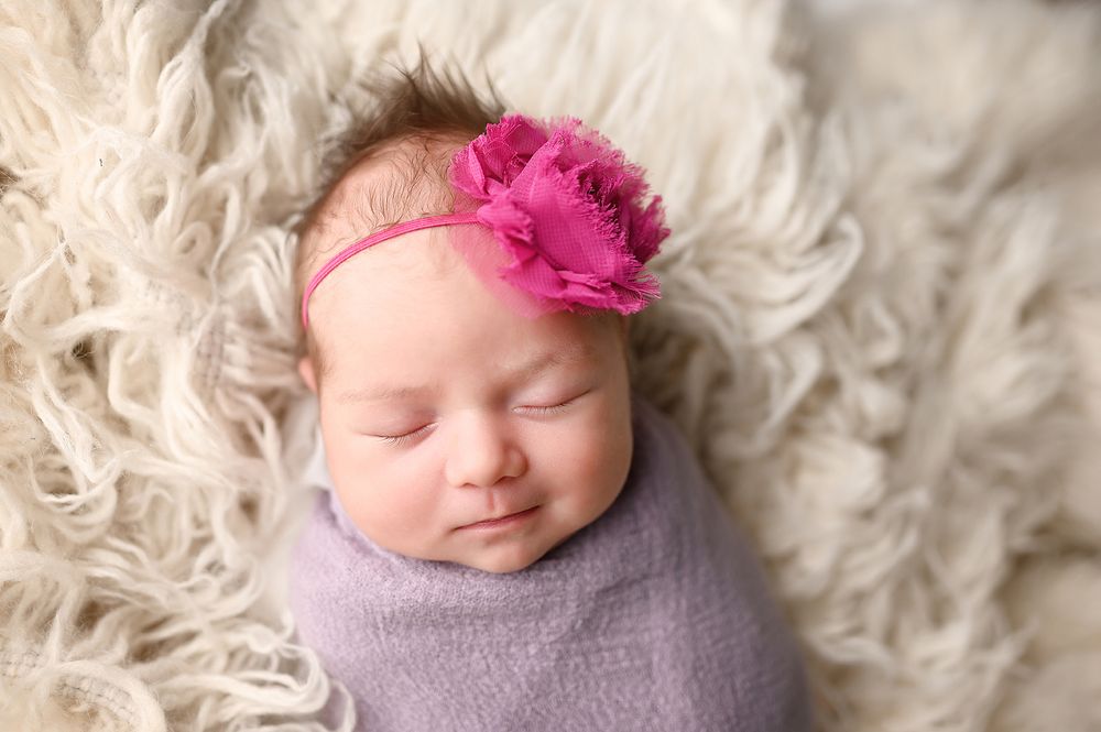 Smiling newborn portrait