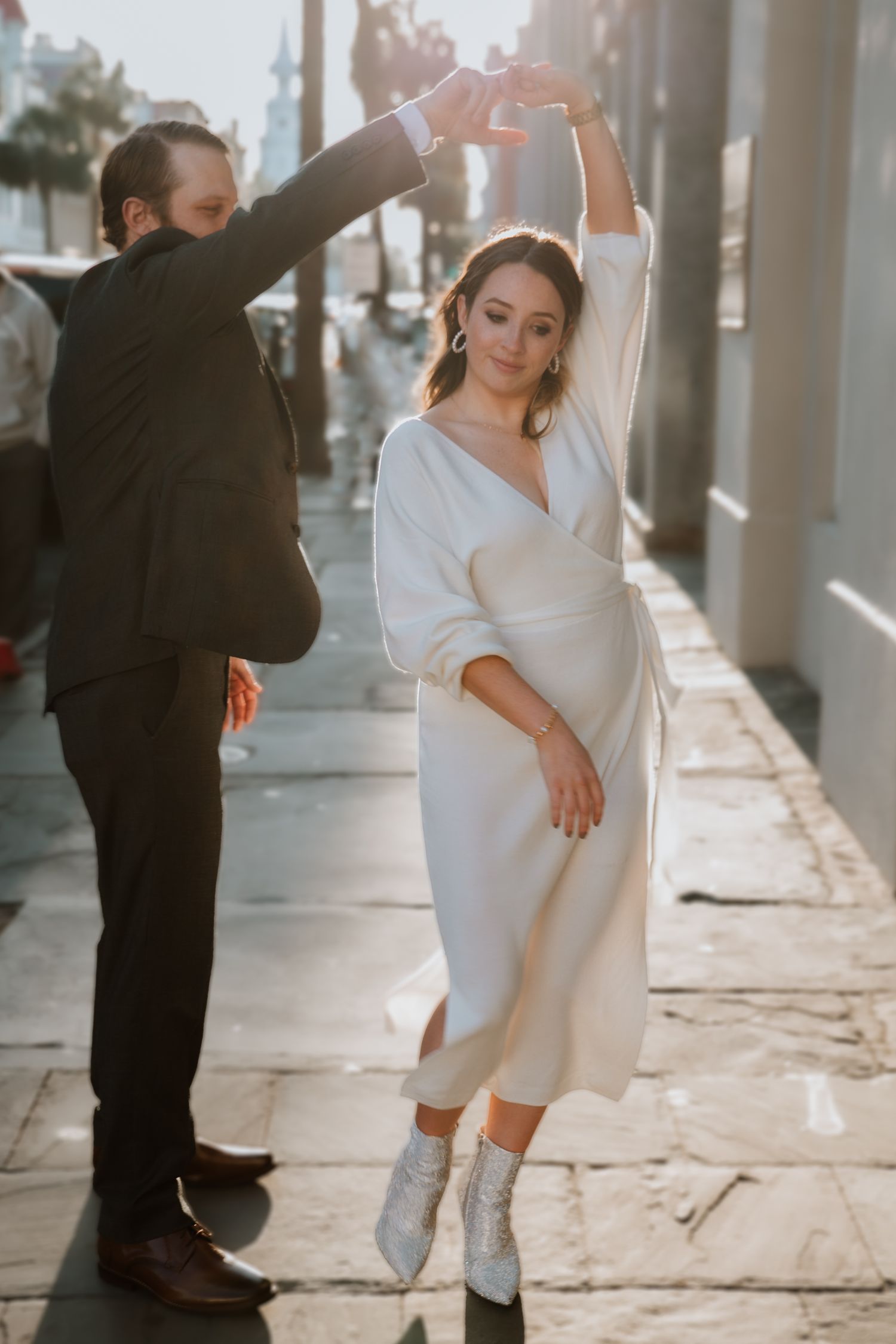 A man twirls his fiancé on Broad Street