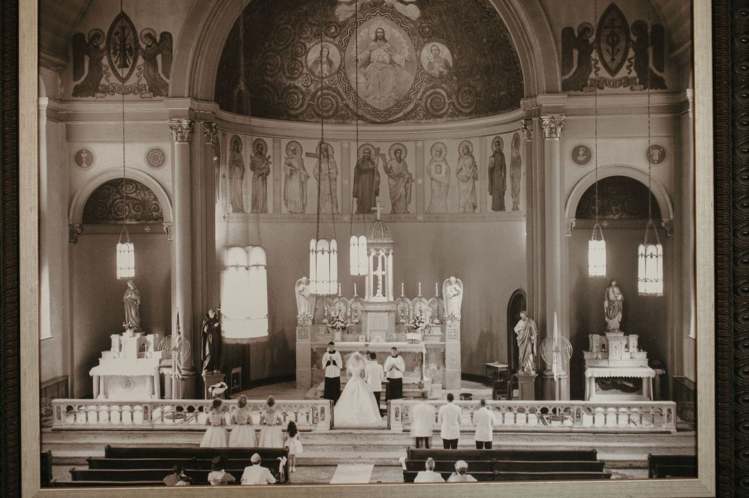 Historic black and white photograph of a traditional church wedding ceremony.