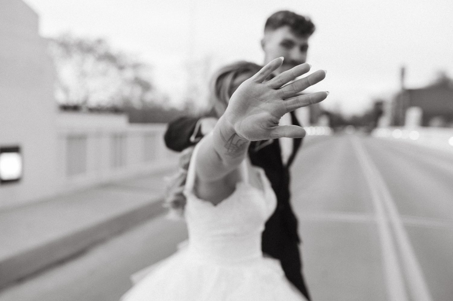 A creative motion blur wedding photo showing a ring display moment.