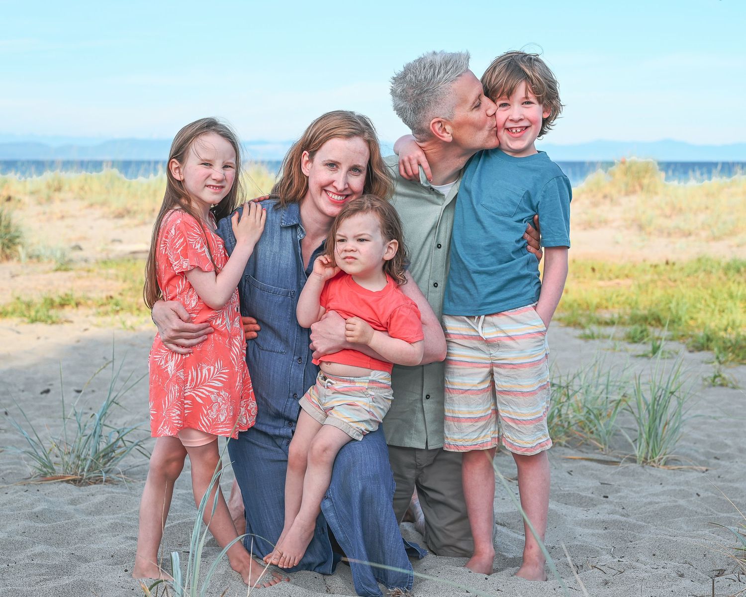 Family pose with 3 young kids