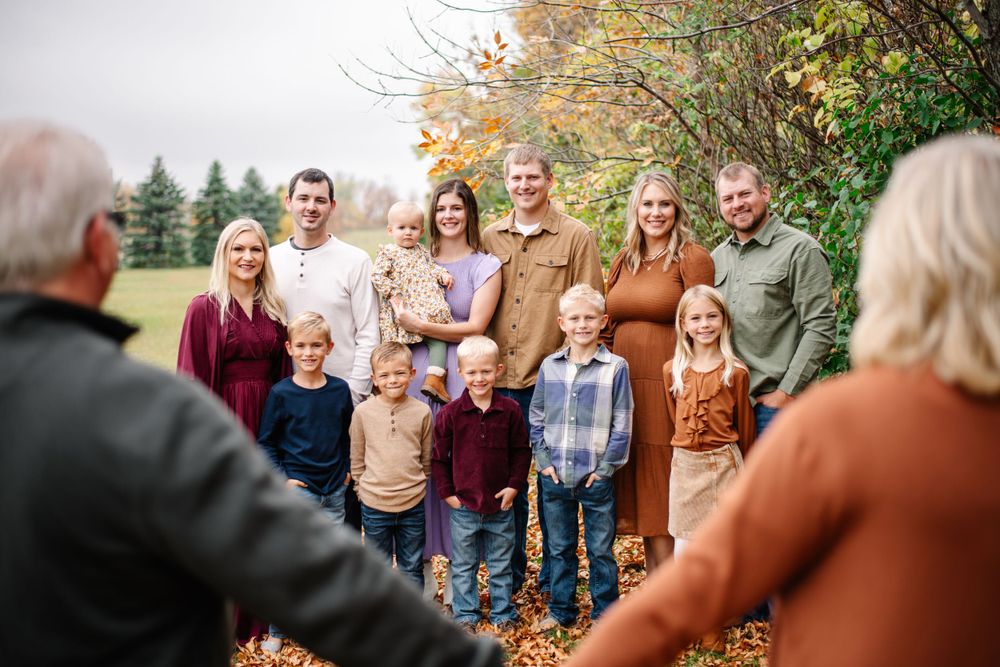 Multiple candid outdoor family portrait shots during fall season.