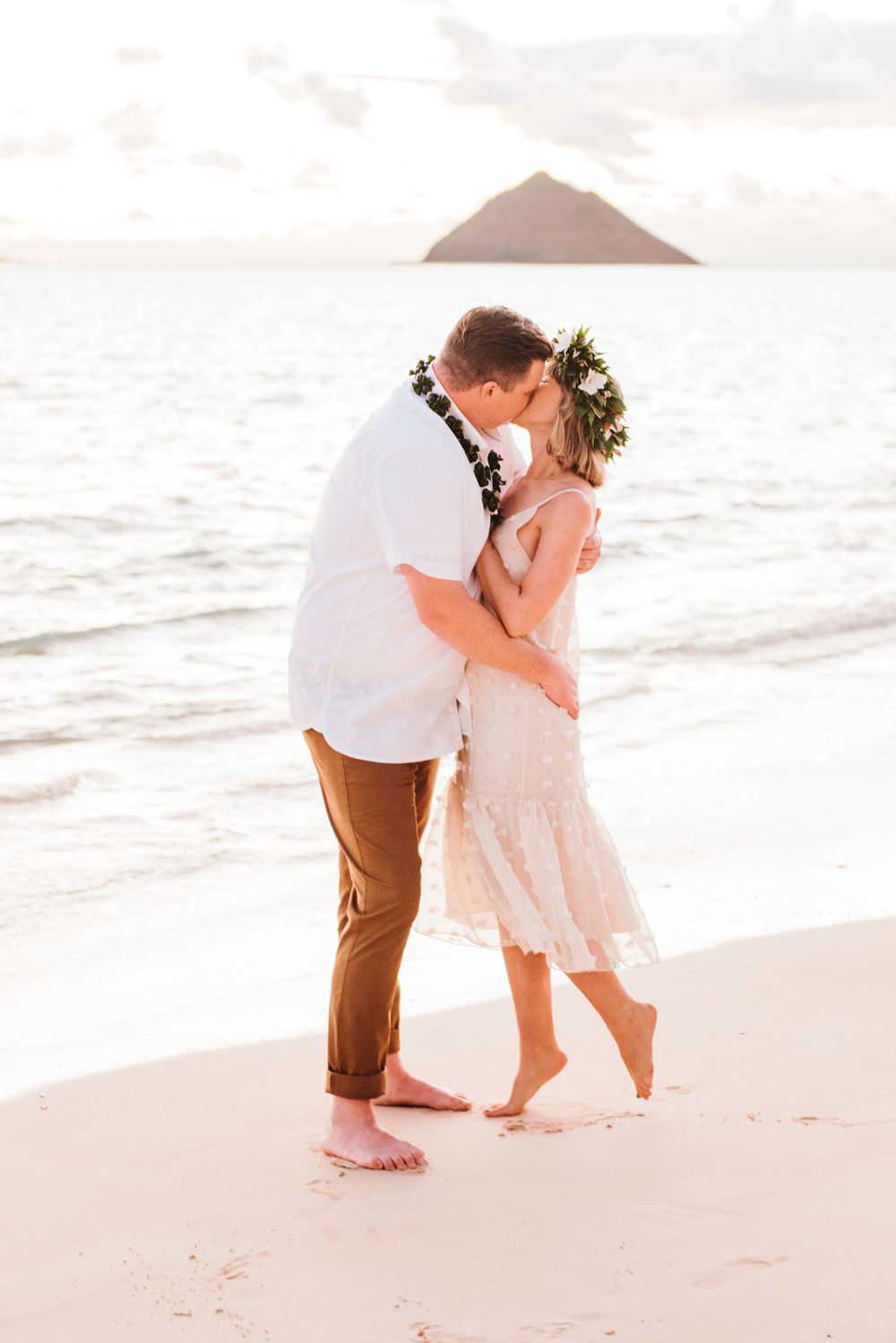 Oahu Hawaii elopement photographer capturing romantic sunrise portraits.
