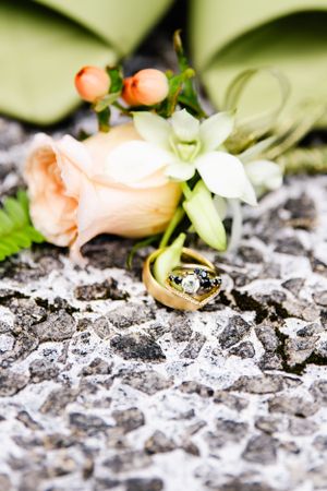 Close up of wedding rings in wedding boutonniere in Kaneohe, Oahu.