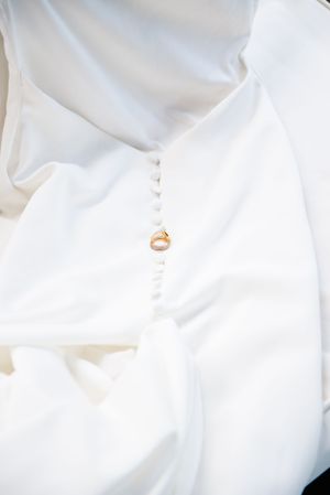 Wedding portraits of wedding dress and wedding rings details in Oahu, Hawaii.