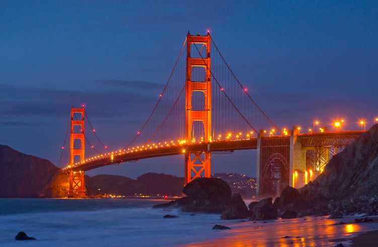 Golden Gate Bridge lit up at night in San Francisco, California, Baker Beach