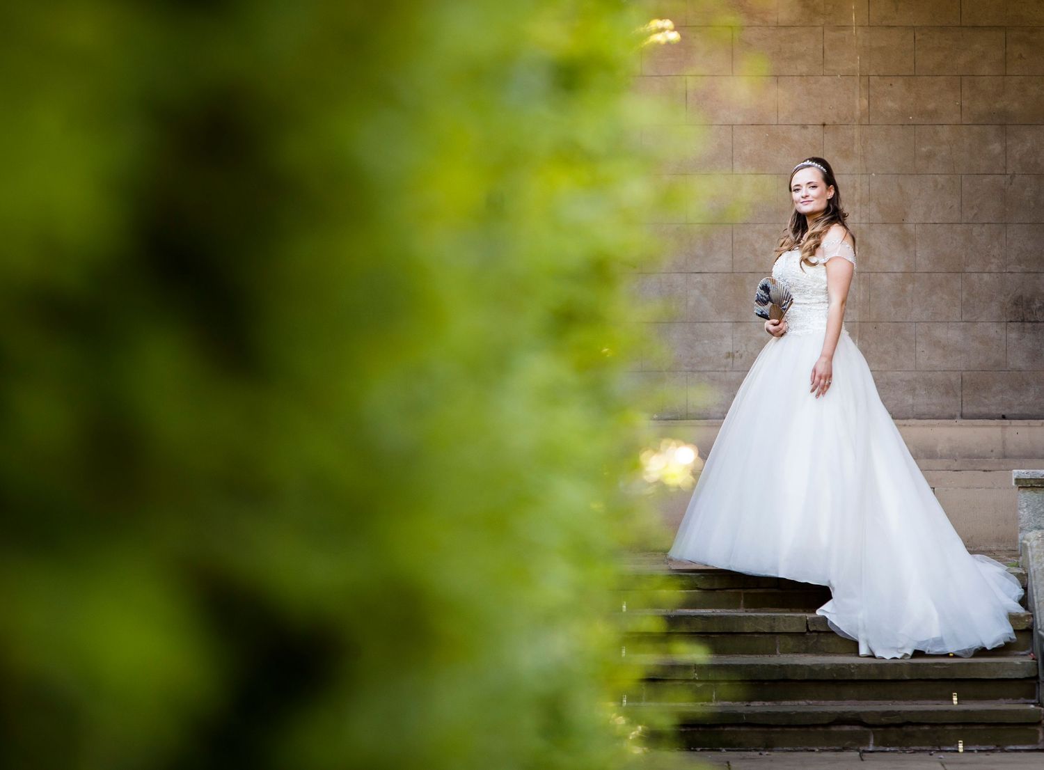classic regal wedding bride photography at hoar cross hall with fan and trailing dress