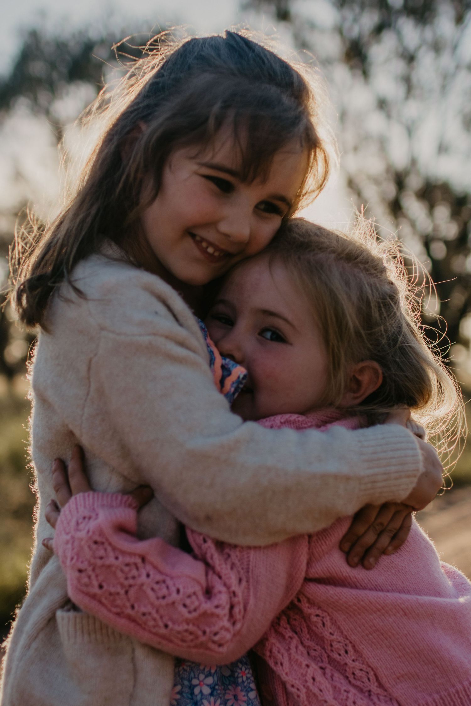 Two girls hugging