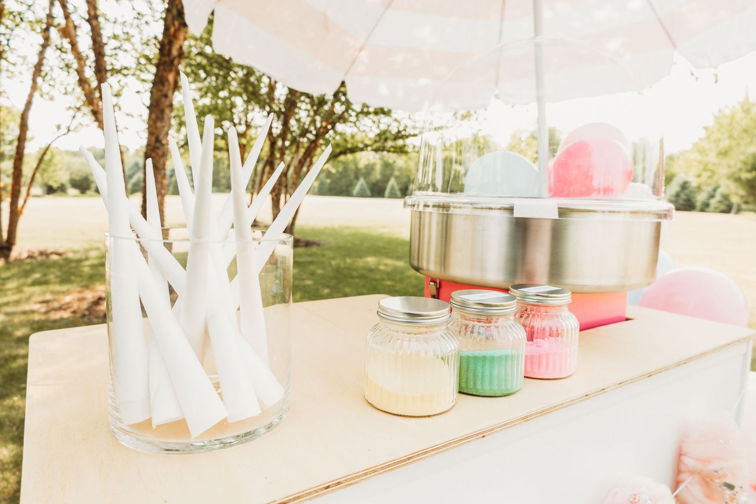 Vintage-style dessert cart setup with pink and blue decorations.