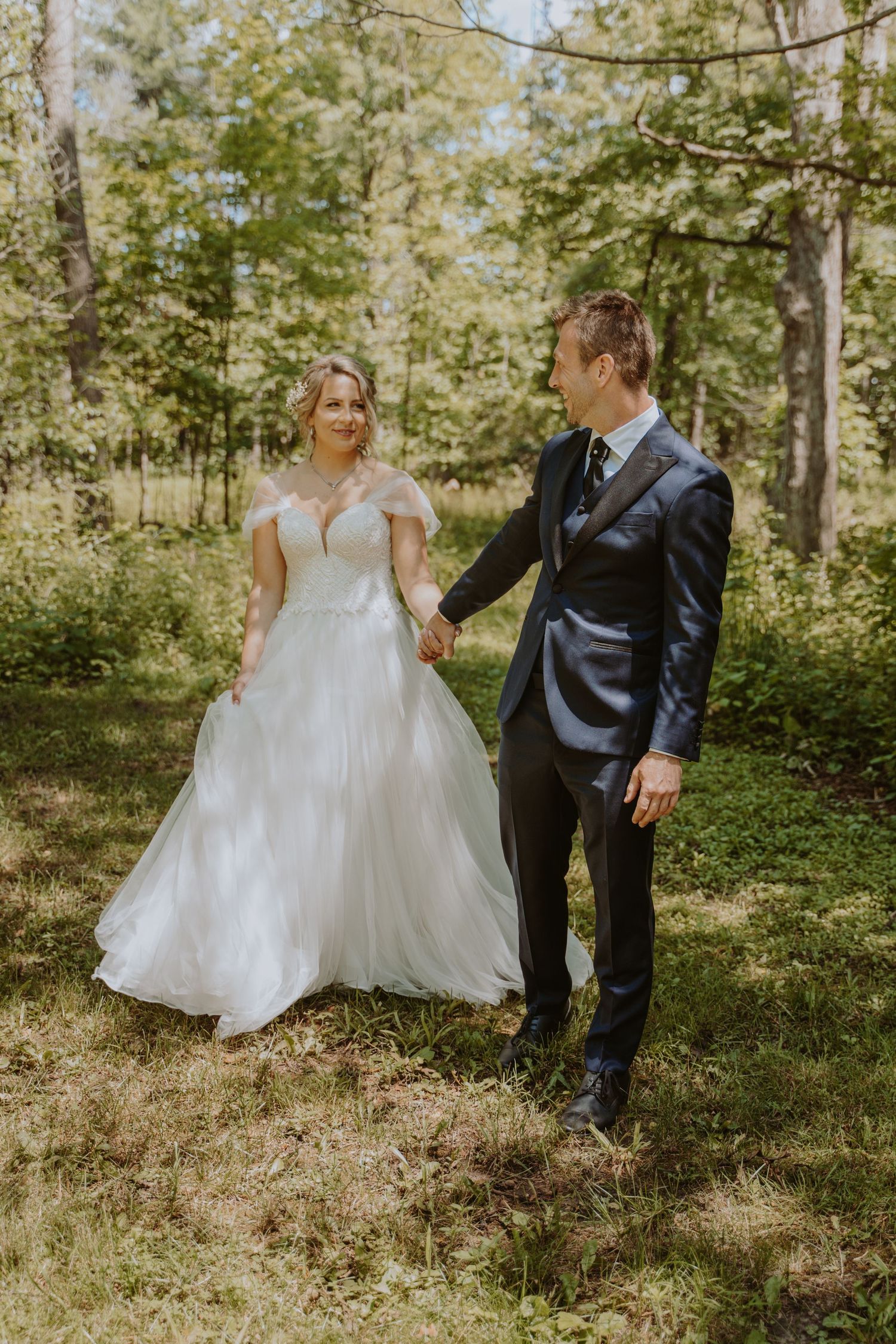 Image of bride and groom in forest.