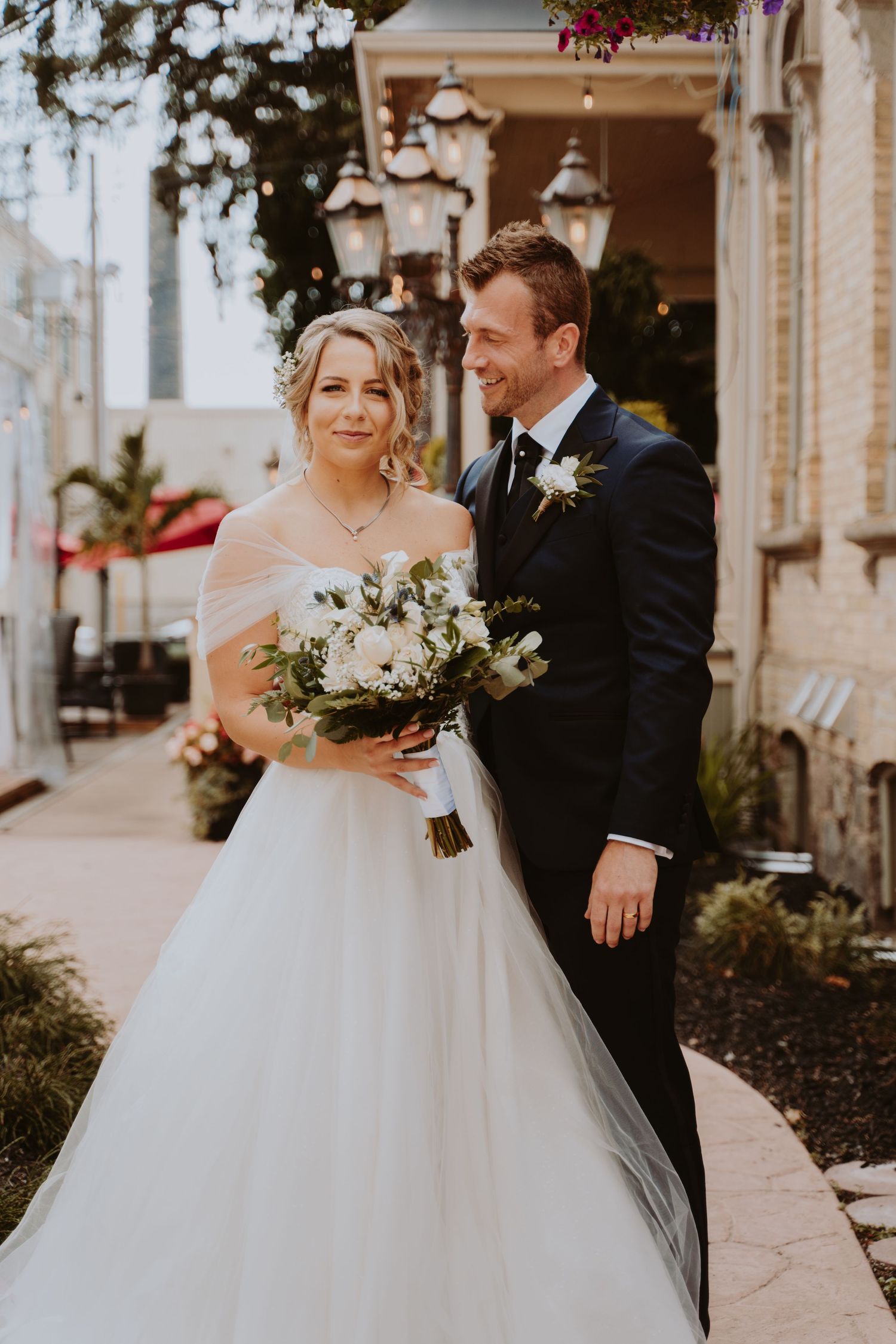 Image of bride and groom smiling.