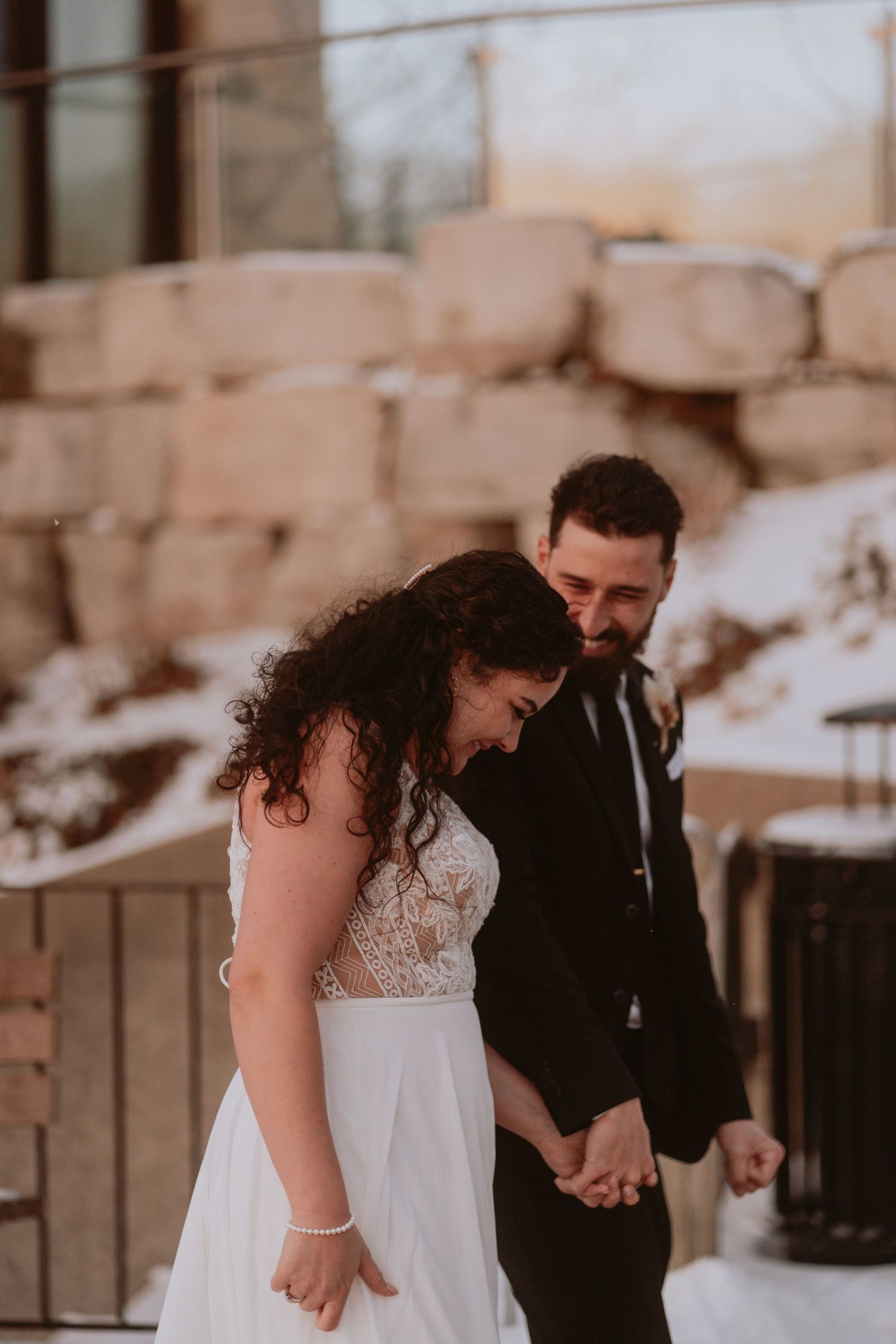 Image of bride and groom walking.