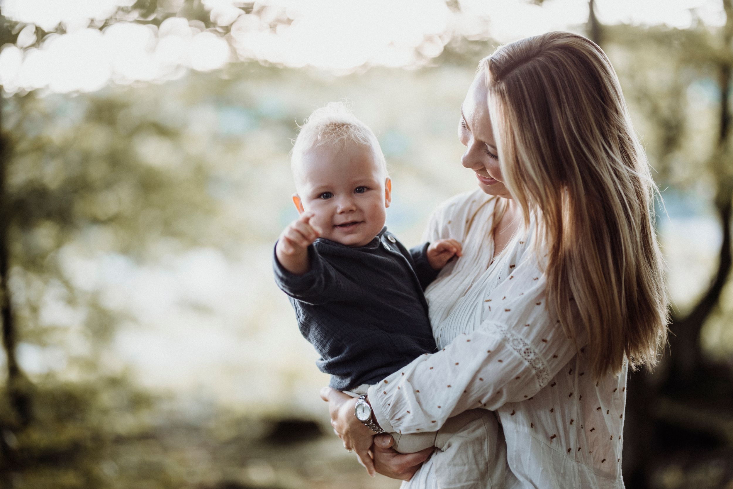 A tender moment captured between parent and child in soft natural lighting.