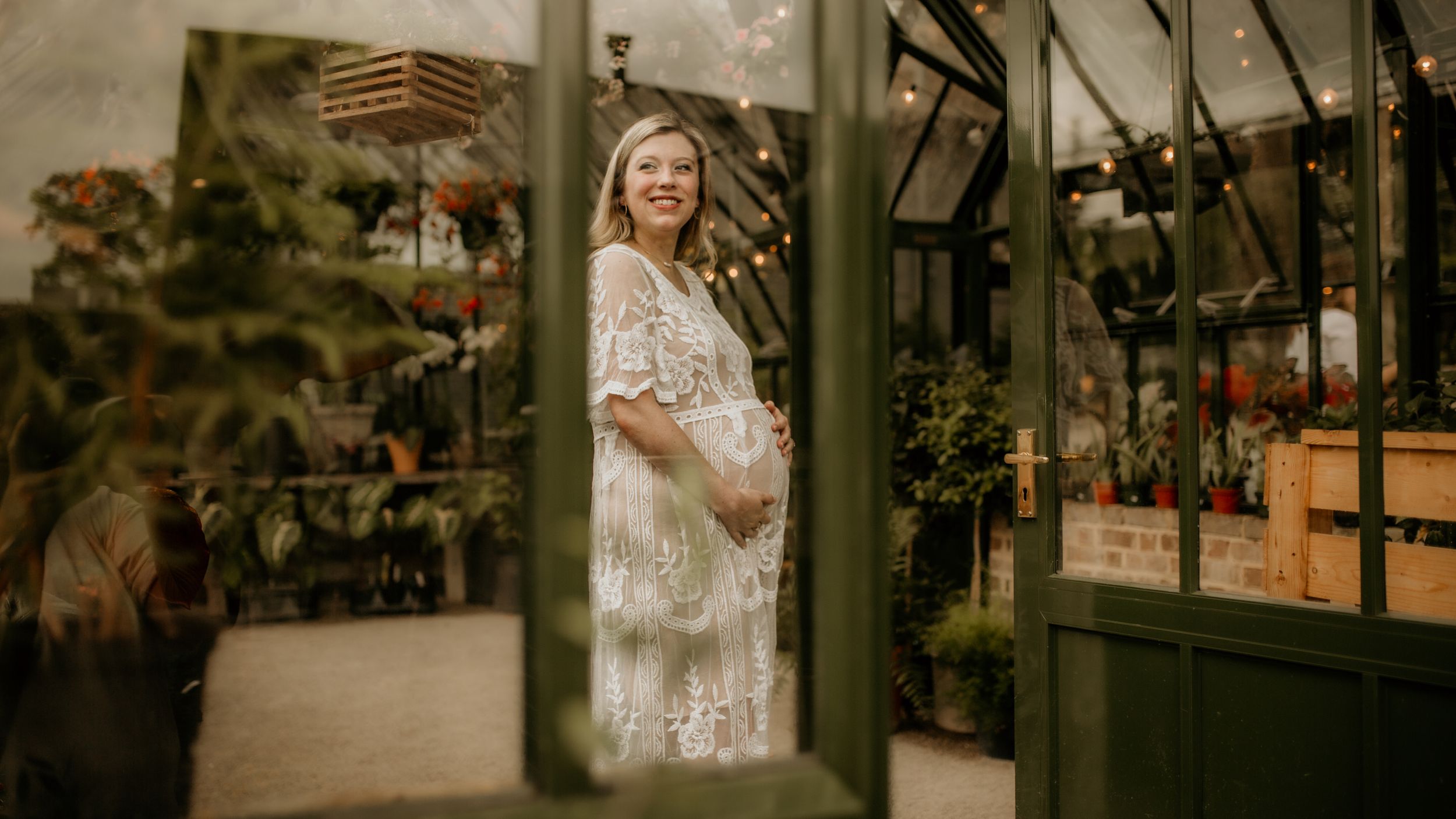 Wedding venue decorated with elegant lighting and rustic details at dusk.