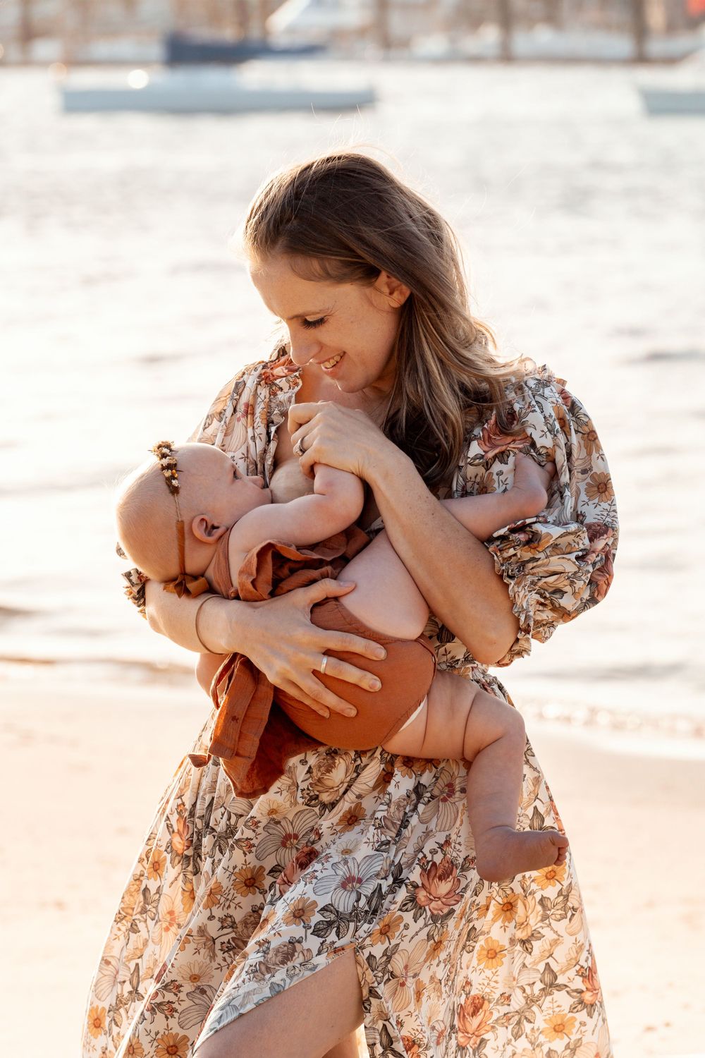 Baby is breastfeeding during a family photoshoot in Sydney