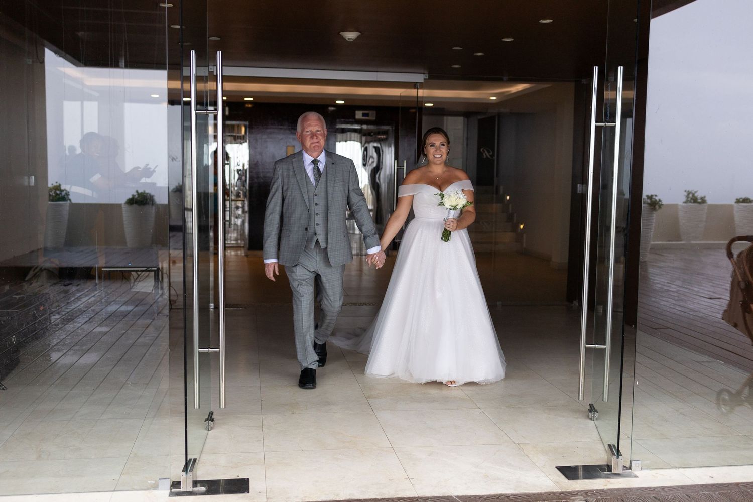 Bride with father walking down the aisle