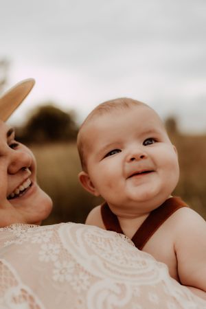 Close-up series of a smiling baby in sepia tones showing pure joy and innocence.