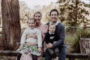 Family members pose together for casual portraits in a wooded outdoor setting.