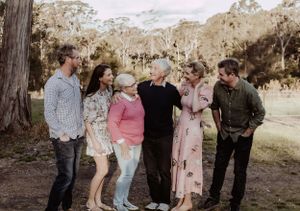Extended family members gather for group photos in a natural outdoor setting.