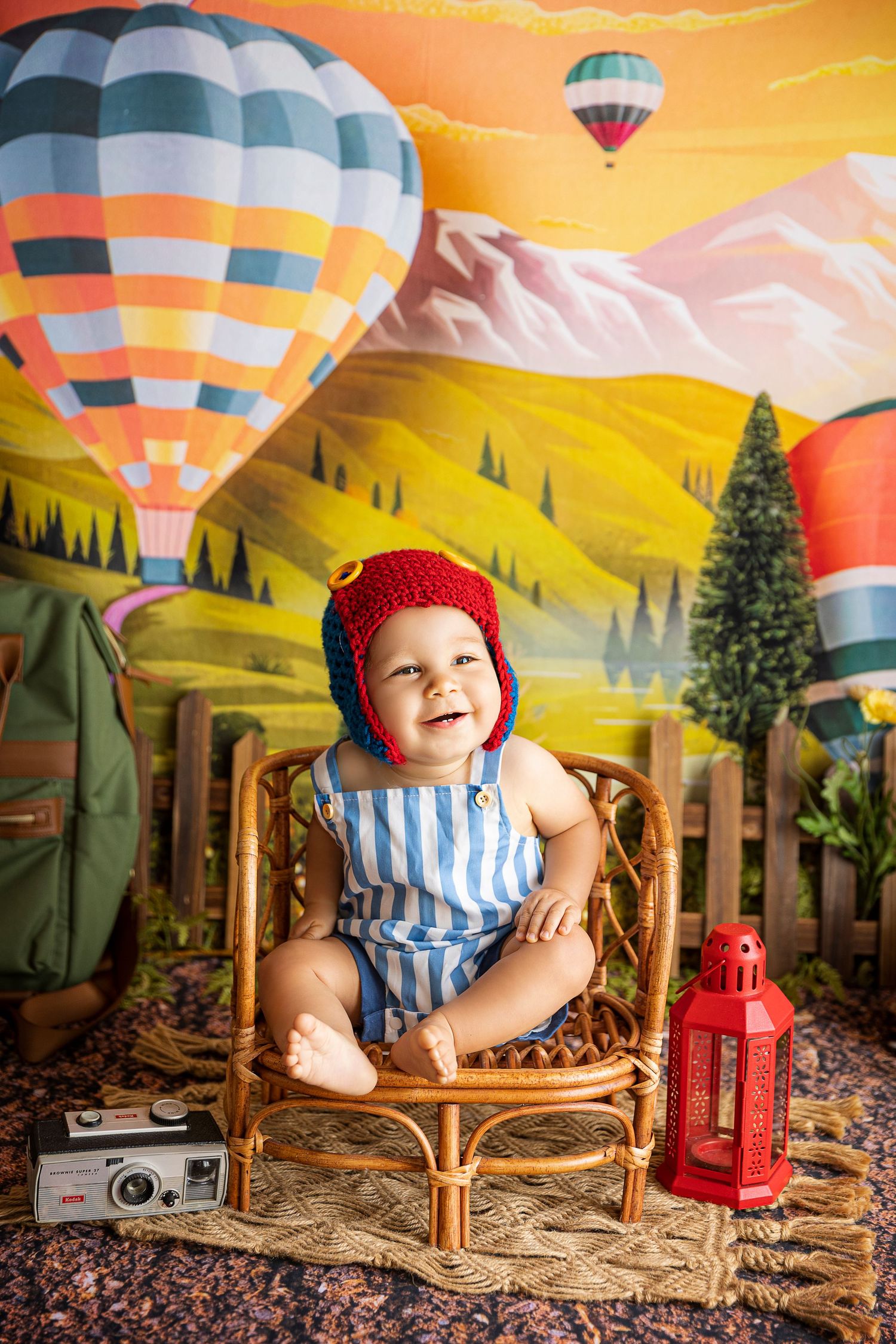 baby boy smiling posing for his studio photography images theme hot air balloons