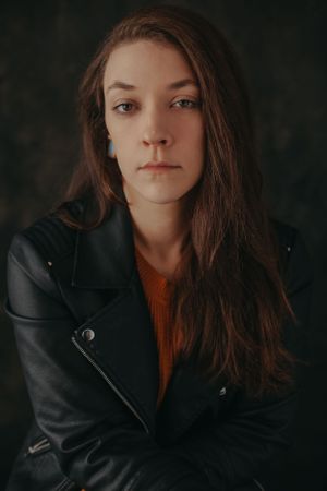 Headshot of sarah in leather jacket