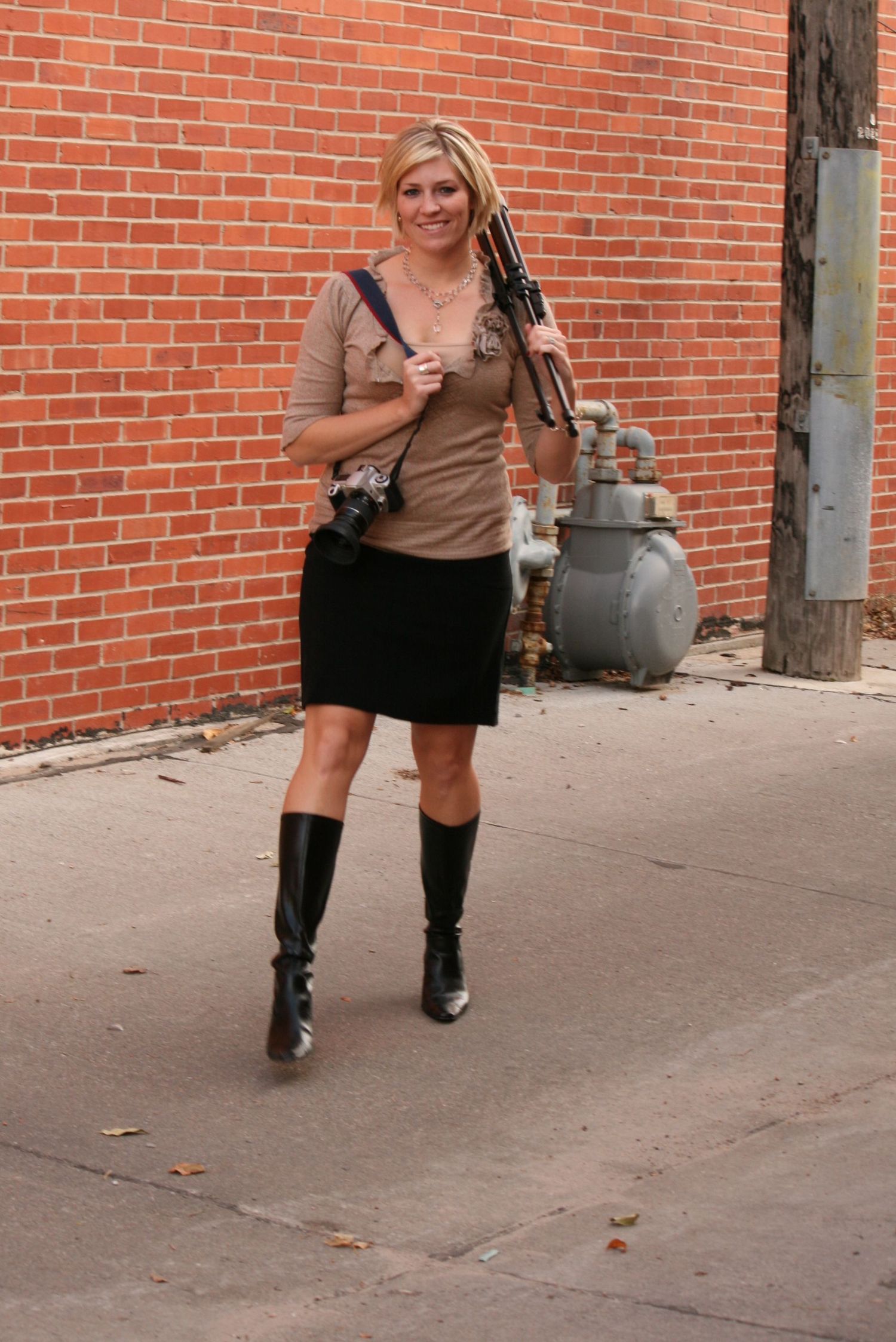 Fashion shots showing boots and accessories against a brick wall background.