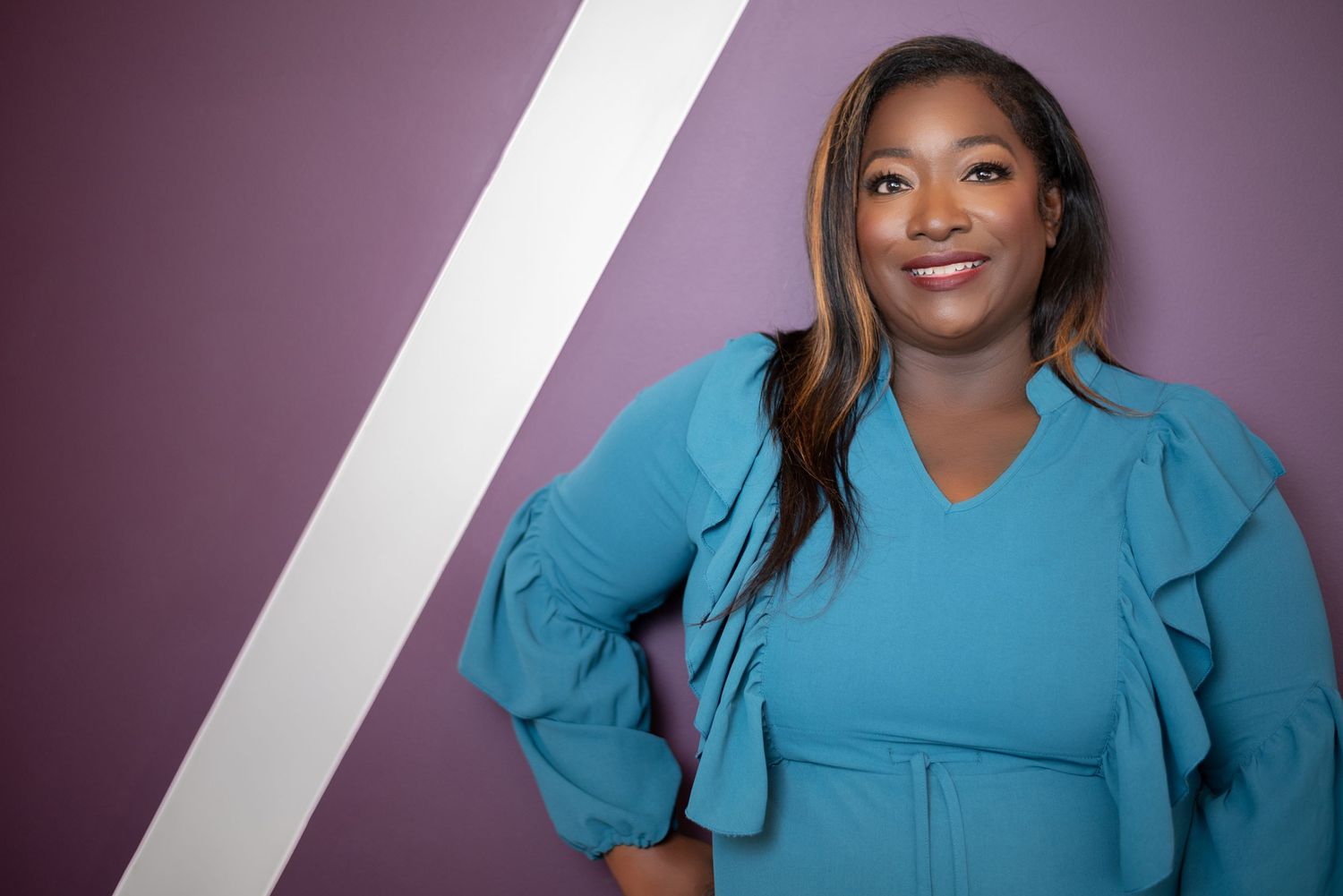 Branding photo of a female entrepreneur with her product line in Evans, GA