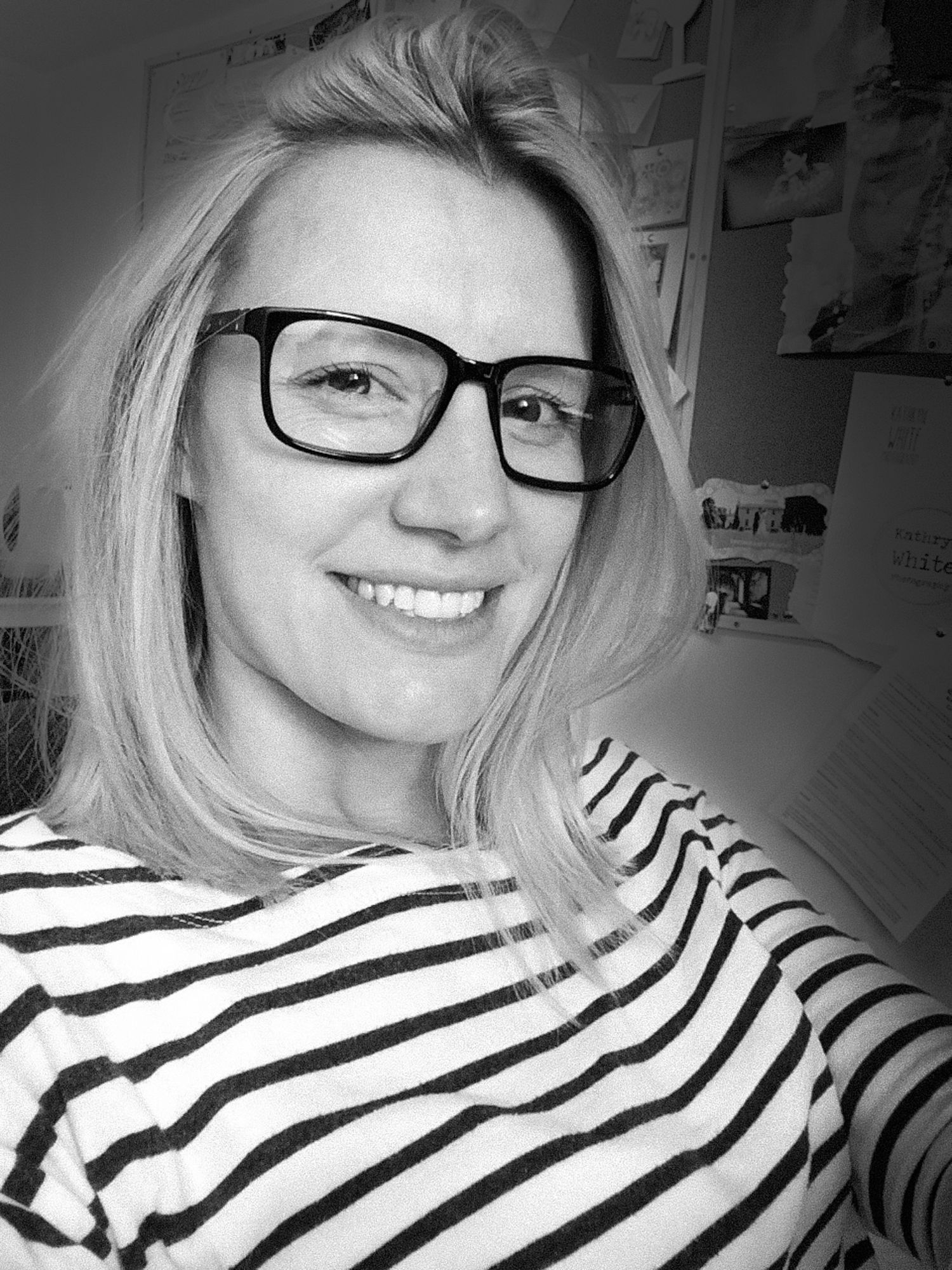 black and white photo of Kathryn White smiling