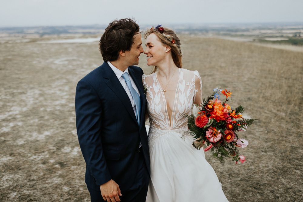 Wedding couple portraits  at Uffington White Horse in Oxfordshire