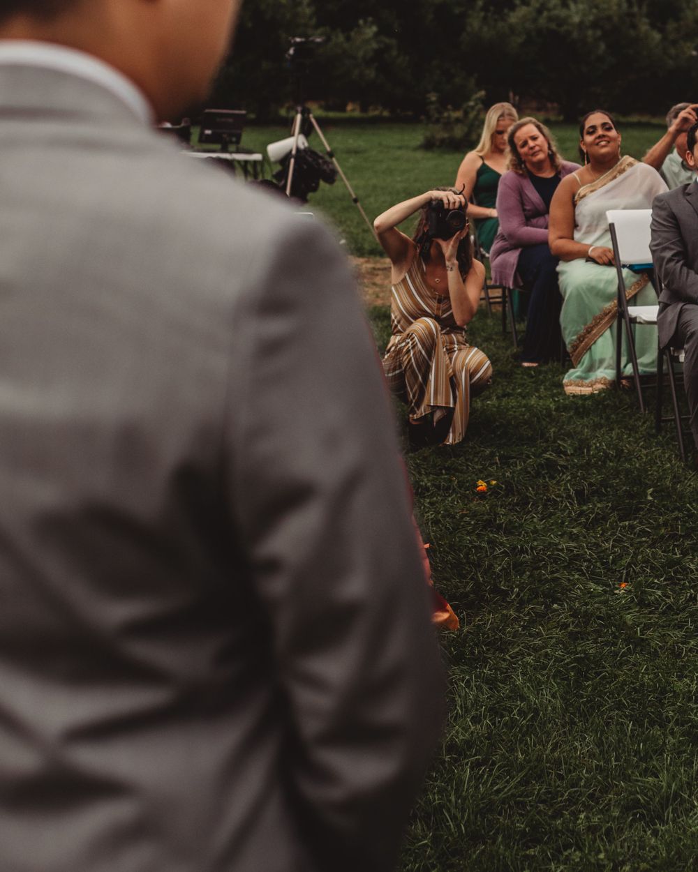 Gallagher photography putting together some final touches for a maine backyard wedding