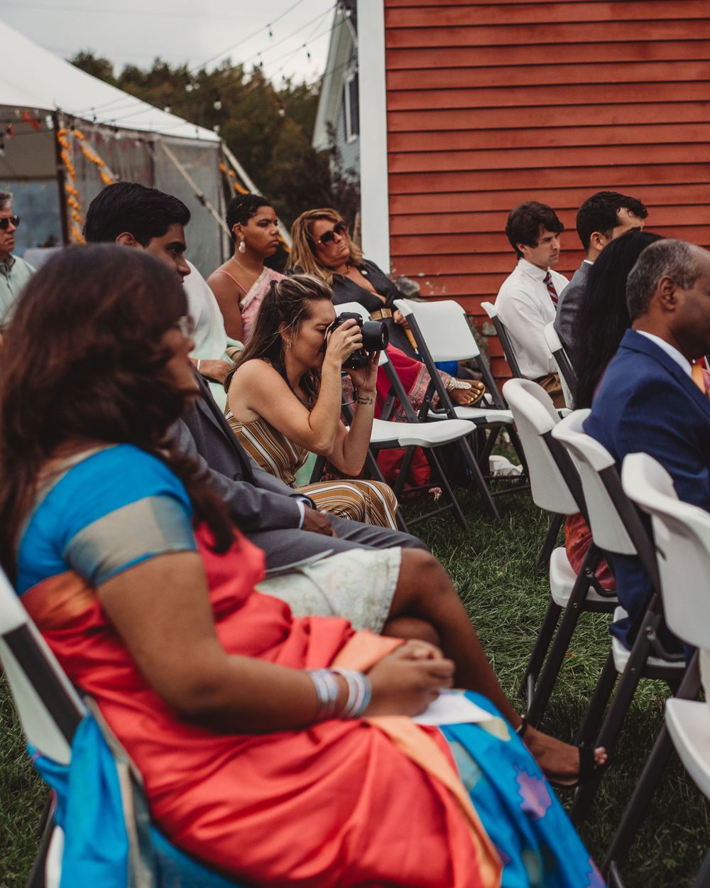 Gallagher photography putting together some final touches for a maine backyard wedding