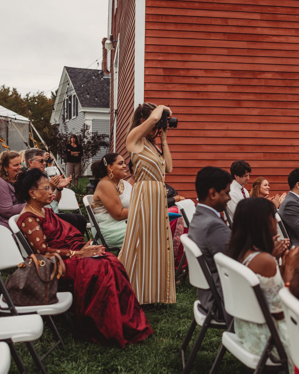 Gallagher photography putting together some final touches for a maine backyard wedding