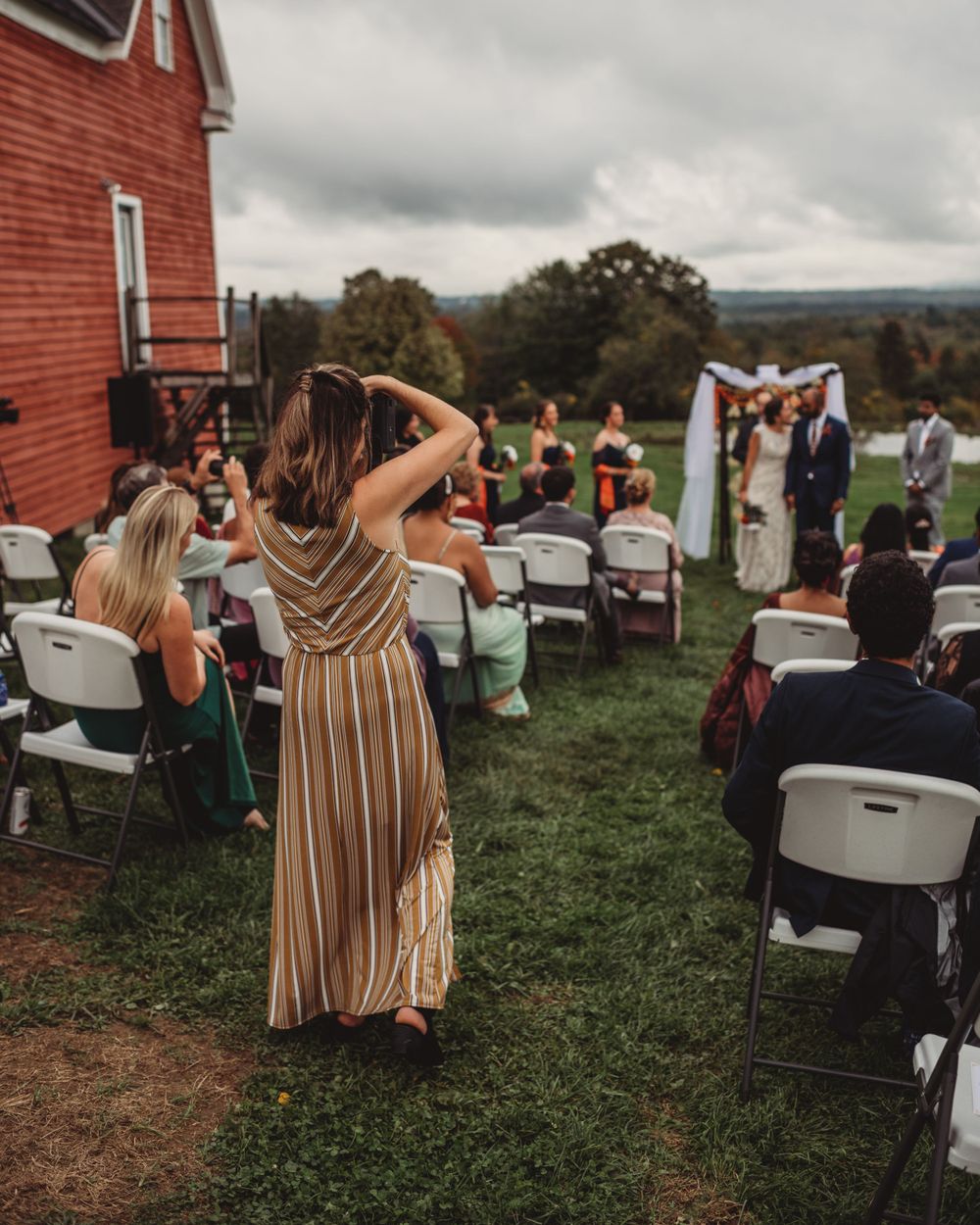 Gallagher photography putting together some final touches for a maine backyard wedding