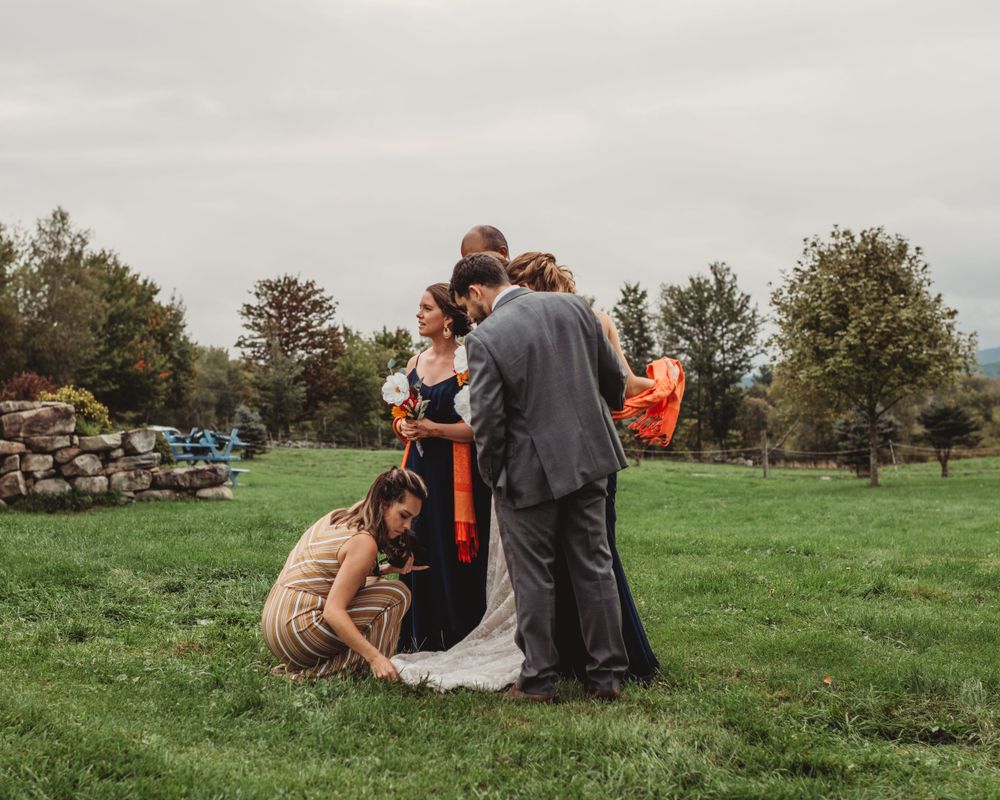 Gallagher photography putting together some final touches for a maine backyard wedding