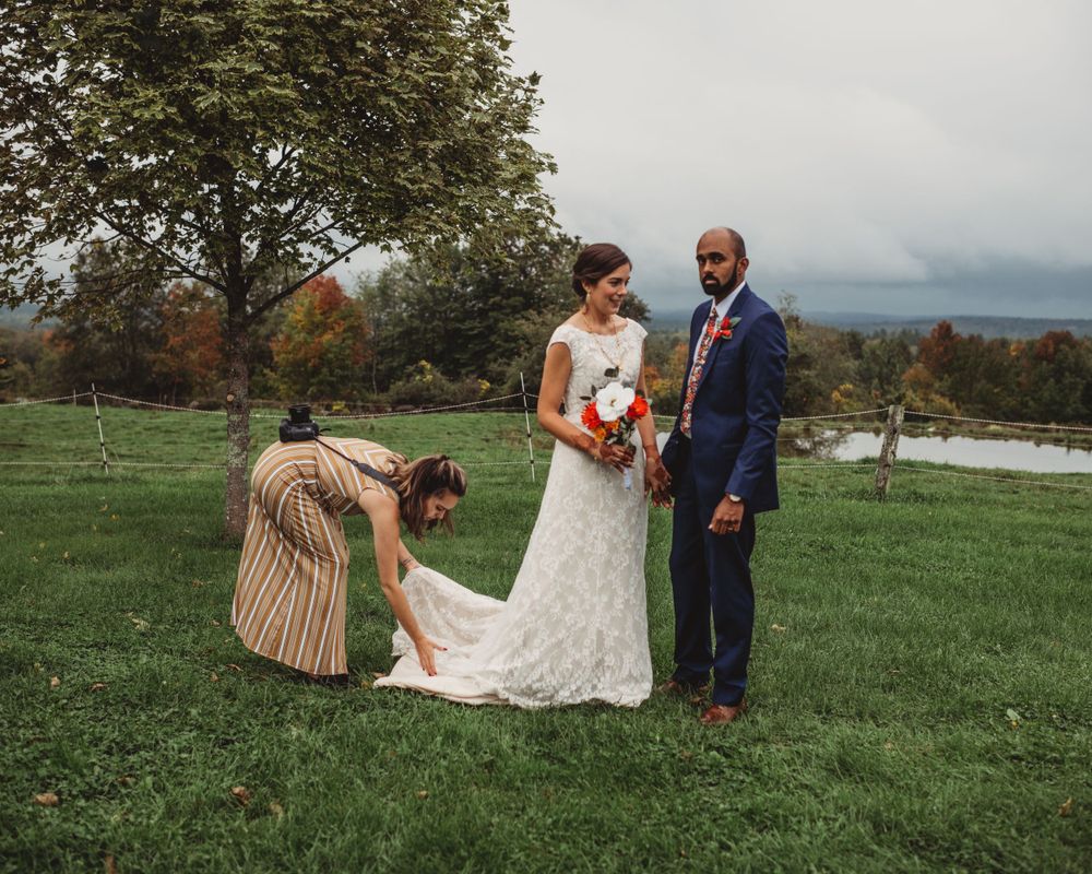 Gallagher photography putting together some final touches for a maine backyard wedding