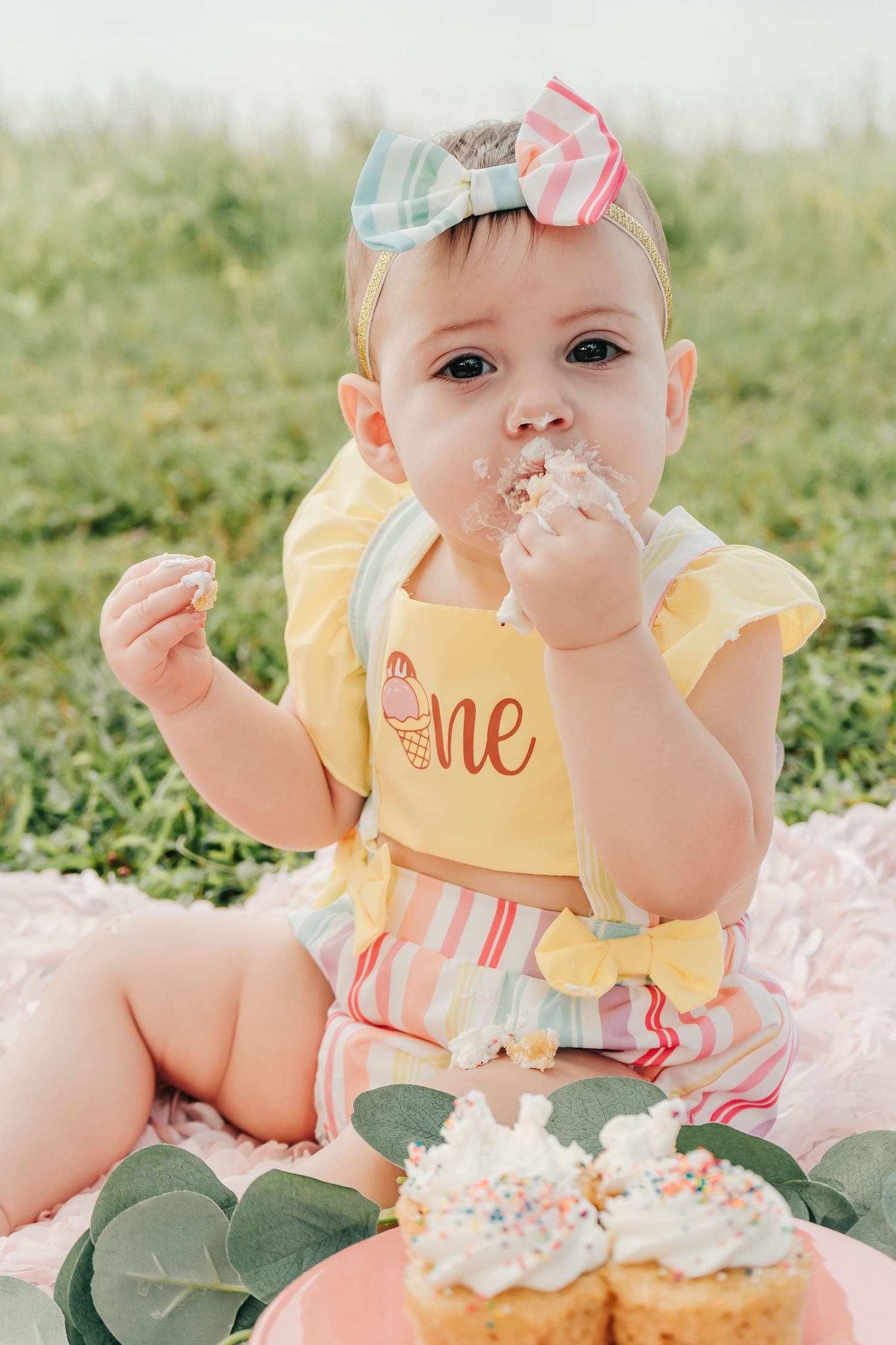 Outdoor Cake Smash Session at Maximo Park in St. Pete, FL; baby eating cupcakes