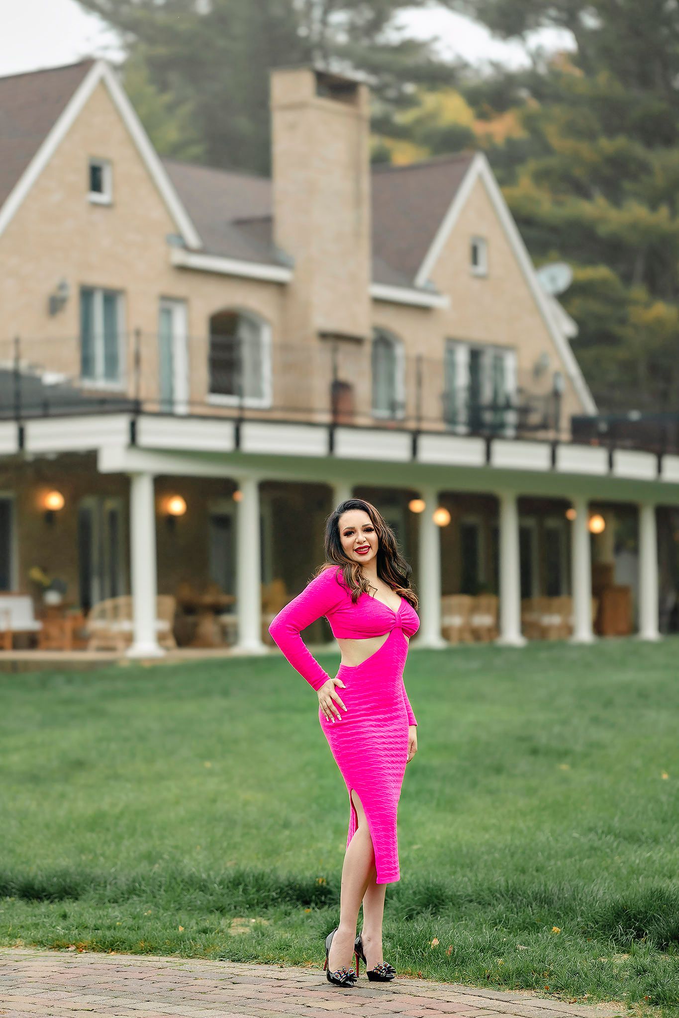 Artistic photo series with pink dress against suburban house backdrop.