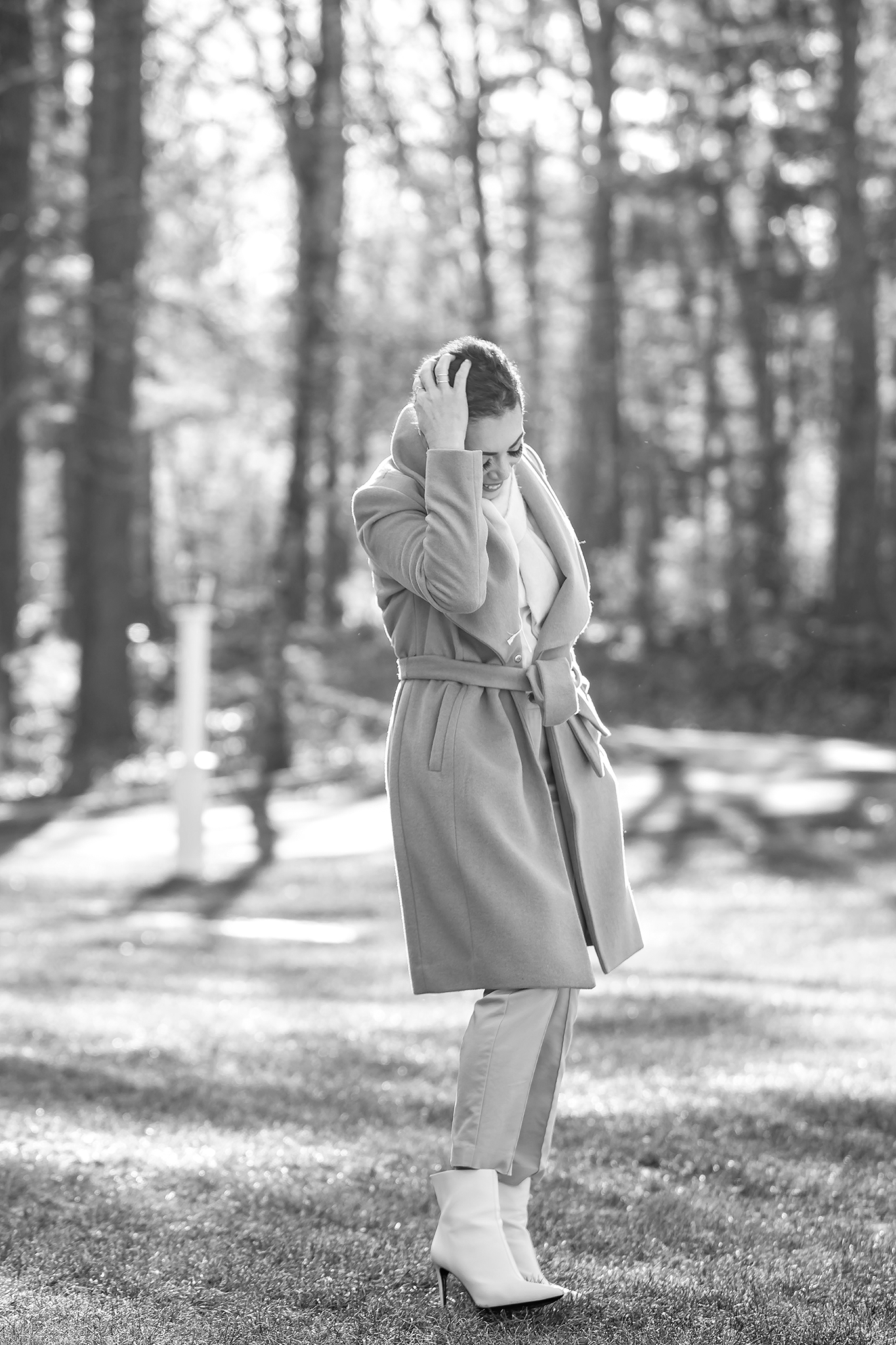 Artistic black and white photography in a forest setting featuring monochromatic fashion.