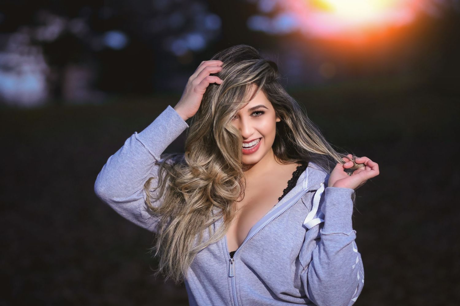 Casual fashion photo shoot during golden sunset hour outdoors.