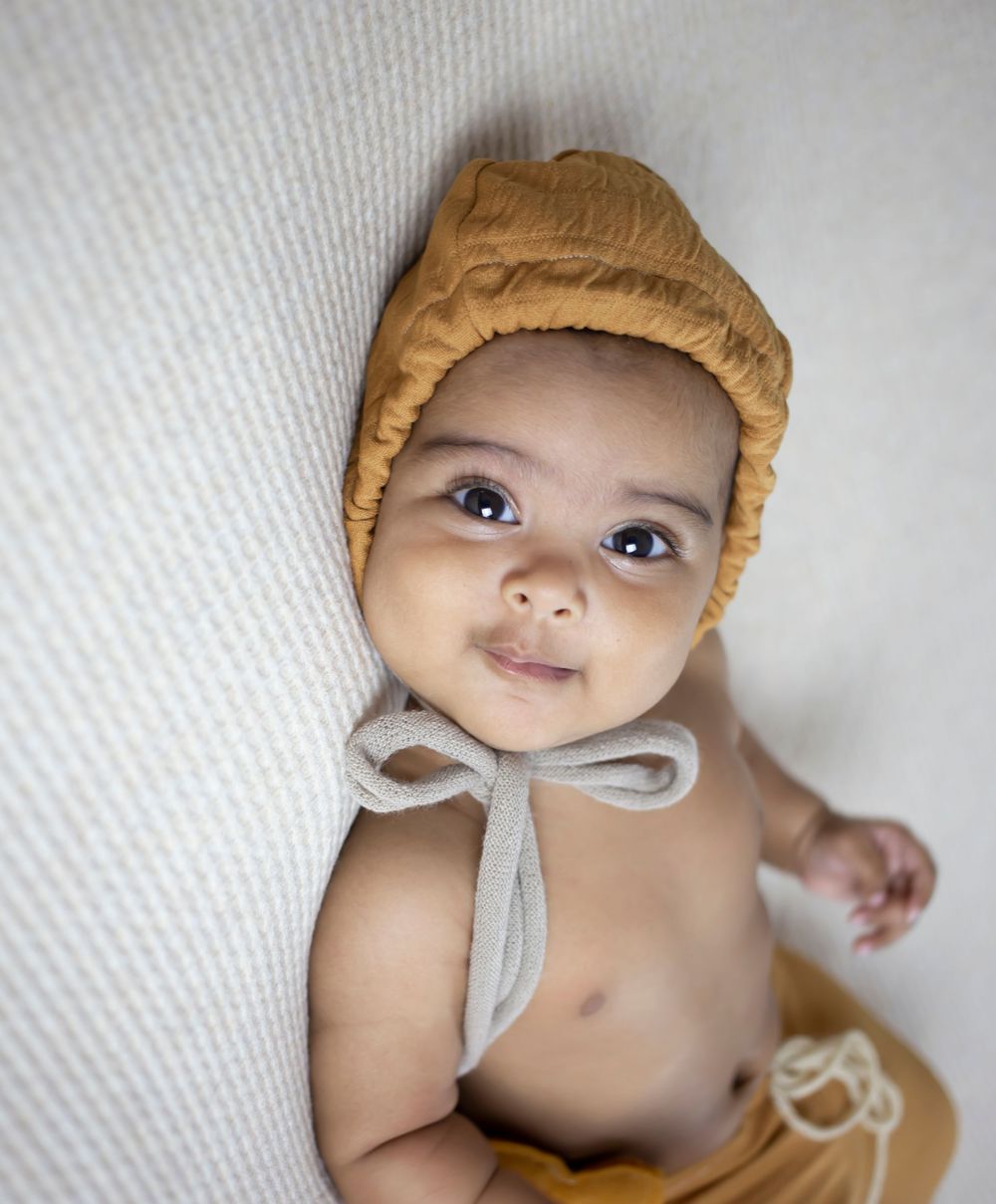 baby girl in yellow